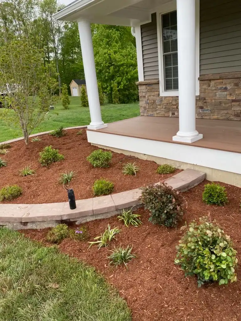 Foundation planting along a front porch